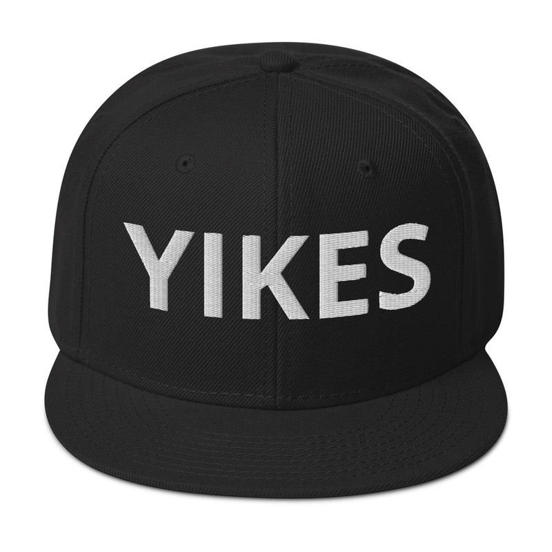 Front of black hat with the word 'YIKES' in light gray letters.