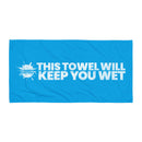 Blue towel with text stating this 'towel will keep you wet'.