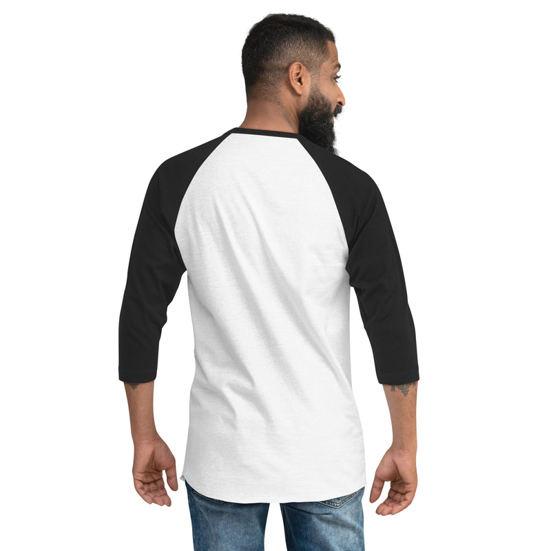 A man facing away from the camera wearing a white three-quarter sleeve baseball-style shirt with black sleeves and collar trim. The back of the shirt is plain with no visible design.