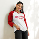 A woman leans against a wall wearing a white and red raglan sleeve shirt with 'CHILL CHUMS SINCE 2018' printed in red across the front.