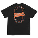 Black short-sleeve T-shirt laid flat, back view. The back of the shirt shows a large orange and white graphic featuring 'Casuals' in script centered inside a vertical oval outline with 'EST. 2025' at the top and 'WITH KATIE NOLAN' at the bottom.