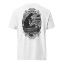 Back view of a white heavyweight T-shirt featuring a large black-and-white vintage-style illustration centered on the upper back. The artwork shows a hooded skeleton rowing a small wooden boat on water, framed by ornate scrollwork. A ribbon banner reads ‘MORBID’ and ‘2018,’ and the text ‘SHE BECOMETH SO LAME’ appears below the illustration.