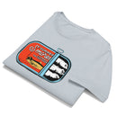 Folded light blue unisex t-shirt featuring a 'Summer S’mores with Conan & the Chill Chums' sardine can graphic printed on the chest.