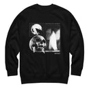 Front view of a black crewneck sweatshirt with long sleeves and ribbed cuffs and hem. Centered on the chest is a monochrome collage graphic arranged in three rectangular panels. The top left panel shows a raven perched on a branch silhouetted against a full moon. The lower left shows a large realistic skull. The right panel shows a ghostly figure draped in white standing in a doorway. Text reads ‘HAUNTED BY MORBID’ above the right panel and ‘MORBID’ near the lower right.
