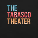 Close-up view of the colorful text ‘THE TABASCO THEATER’ on a black background. The words are stacked vertically in blue, red, and orange with marquee-style white dots.