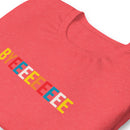 A close-up view of a folded heather red T-shirt featuring the word 'BYEEEEEEEE' in a multicolored, horizontal block-letter design across the chest.