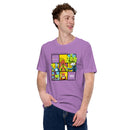 A man smiling and standing with one hand in his pocket while wearing a heather purple short-sleeve T-shirt. The shirt displays a bright comic-style front design divided into six panels with the text 'HIDDEN LEVELS,' '99% Invisible,' and 'Endless Thread.'