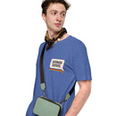 A person wearing a heather royal blue T-shirt with a graphic on the chest that says 'SAYONARA SUCKERS' in bold text above a rainbow-striped underline.