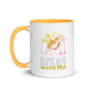 White mug with a yellow interior featuring hands holding a planet and the text 'Stars and Stars with Isa'.