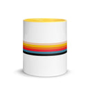 A white mug with a yellow handle, featuring the word 'SMARTLESS' and colored stripes in various shades.