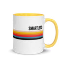 A white mug with a yellow handle, featuring the word 'SMARTLESS' and colored stripes in various shades.