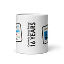 A side view of the white mug showing vertical text that reads 'Comedy Bang! Bang! 16 YEARS', with parts of the novelty license graphic visible on both sides.