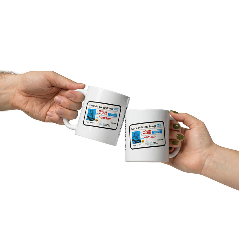 Two hands clinking identical white mugs printed with the 'Comedy Bang! Bang!' license graphic, celebrating the show's 16-year anniversary.