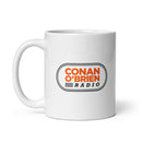 White mug featuring 'Conan O'Brien Radio' logo in orange and black design.