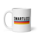 White ceramic mug with the word 'SMARTLESS' printed in black, featuring three horizontal stripes in blue, red, orange and yellow beneath it.