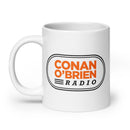White mug featuring 'Conan O'Brien Radio' logo in orange and black design.