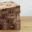 Gift boxes wrapped in brown paper featuring Better Tomorrow with Hannah Brown design on a wooden surface against a white wall.