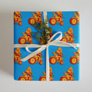 Blue wrapping paper featuring a 'Comedy Bang! Bang!' logo.