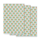 Colorful patterned wrapping paper featuring abstract shapes in pastel hues arranged in a repeating design.