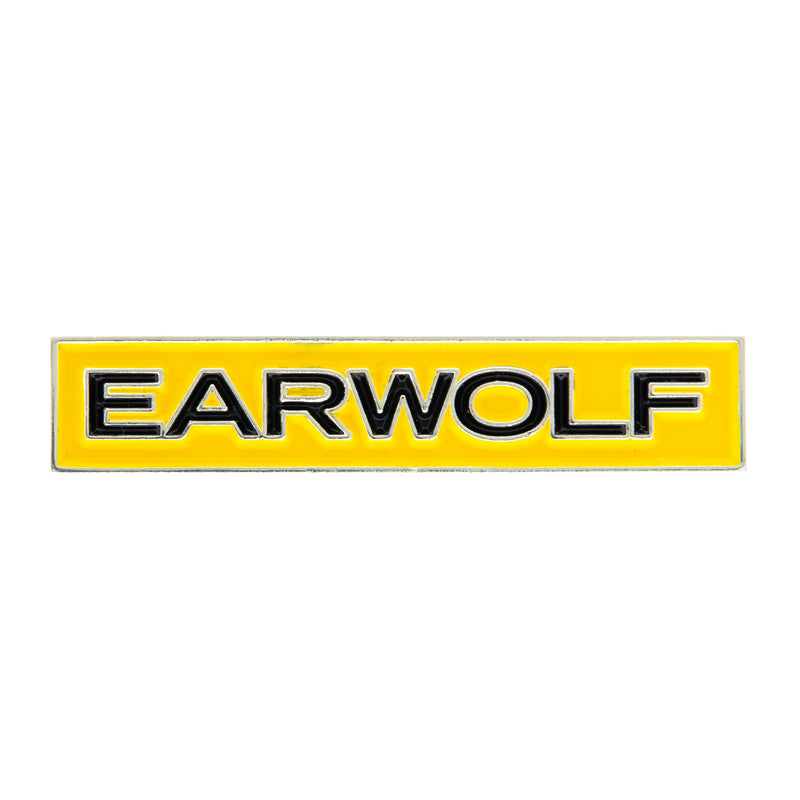 Earwolf' logo enamel pin on a yellow background with black lettering