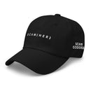 Black baseball cap with the text 'SCAM(HER)' on the front and the 'Scam Goddess' logo in white embroidery on the side.