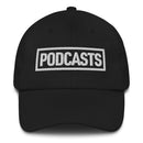 Black baseball cap with embroidered white text reading 'PODCASTS'