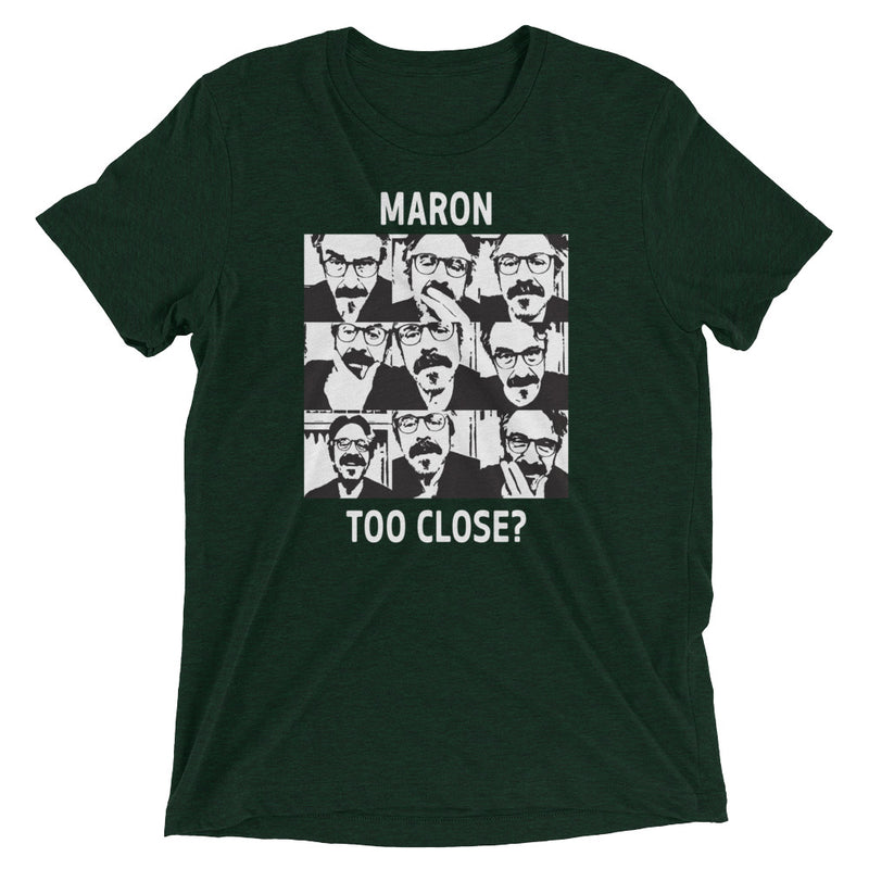 Green graphic tee featuring multiple expressions of a man with glasses, text reading 'MARON TOO CLOSE?'