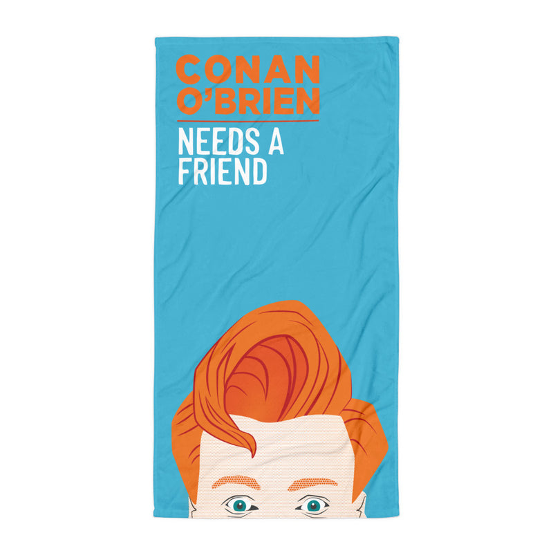 Towel featuring an Illustrated character with orange hair and text reading 'Conan O'Brien Needs A Friend.'