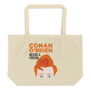 Tote bag with illustration of a man with orange hair and text saying 'Conan O'Brien Needs a Friend.'