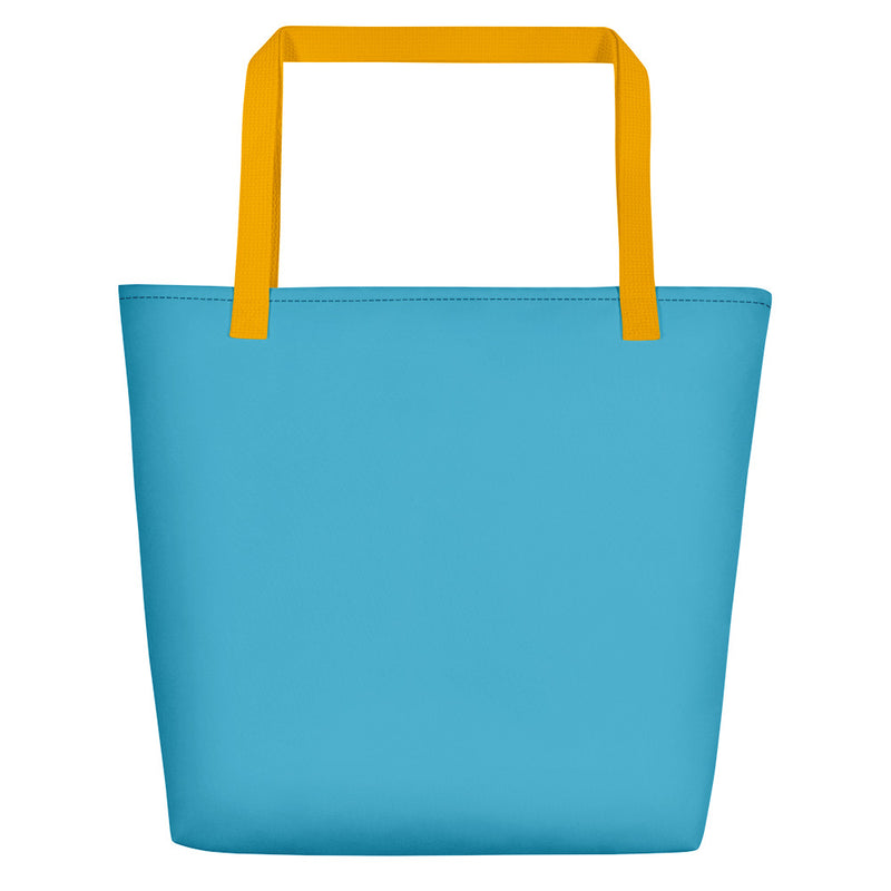 Back side of teal beach bag with yellow handles.
