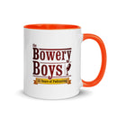 Mug with orange handle featuring 'The Bowery Boys' logo and text celebrating 15 years of podcasting