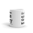 Side view of white mug with partial views of front and back designs.