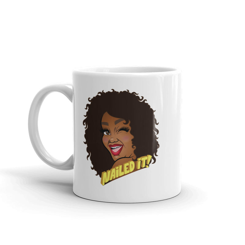 Backside of white mug featuring cartoon illustration of a smiling woman with curly hair and the text 'Nailed It!'