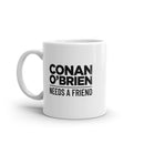 white mug with text 'CONAN O'BRIEN NEEDS A FRIEND.'