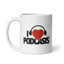 White mug with bold black and text reading 'I Love Podcasts' featuring a red heart wearing headphones graphic.