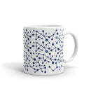 mug with a white background featuring a blue abstract pattern of interconnected lines and dots