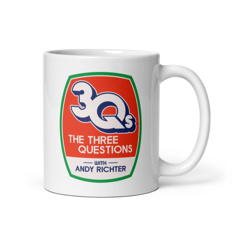 White mug featuring the logo for 'The Three Questions with Andy Richter' with handle on right side.