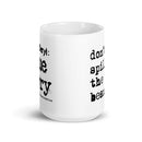 Side view of white mug with partial views of front and back designs.