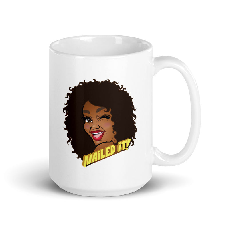 White mug featuring cartoon illustration of a smiling woman with curly hair and the text 'Nailed It!'